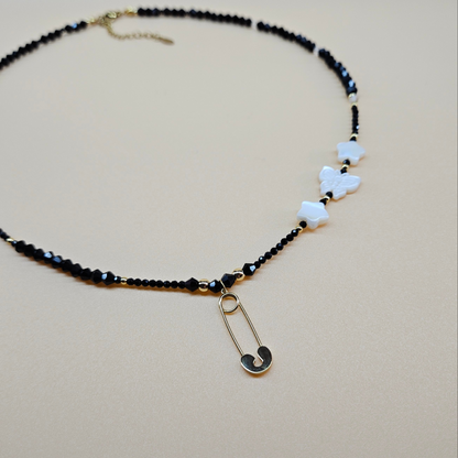 Black Glass Beaded Necklace with Gold-Plated Safety Pin Pendant Featuring Butterfly and Star Shaped Beads