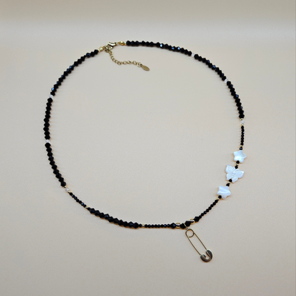 Black Glass Beaded Necklace with Gold-Plated Safety Pin Pendant Featuring Butterfly and Star Shaped Beads